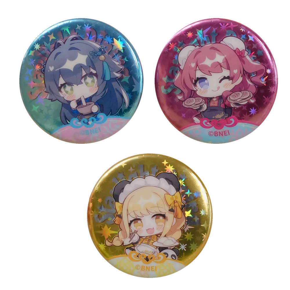 Three chibi Starlight Dining button badges: Temari Tsukimura (blue), Saki Hanami (pink) and Kotone Fujita (gold)