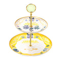 Two-tier dessert stand with white and yellow plates, chibi Typhoeus, Arcane and Camille and a gold-coloured rod