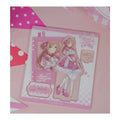 Acrylic stand parts on the printed sheet: Rinami Himesaki figure in a pink lolita dress, base and signature plate