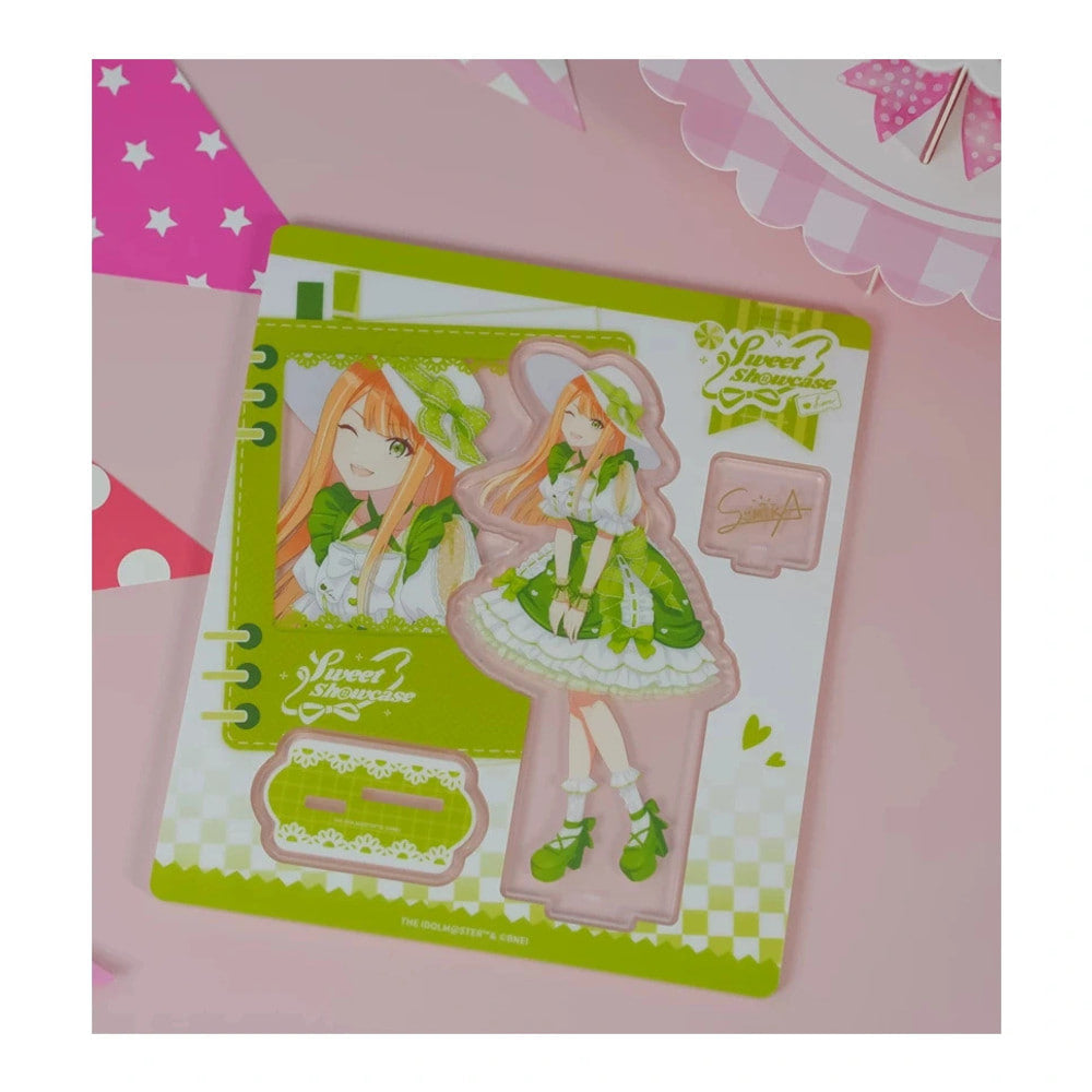 Acrylic stand parts on the printed sheet: Sumika Shiun figure in a green lolita dress, base and signature plate