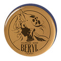 Round amber acrylic block with a silhouette portrait of Beryl and the text COLOPHANE · ROSIN BERYL