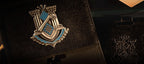 Close-up of the silver and blue metal crest inside the card holder