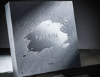Front of the gift box: embossed snowfield texture with silver-foil PARADISE lettering