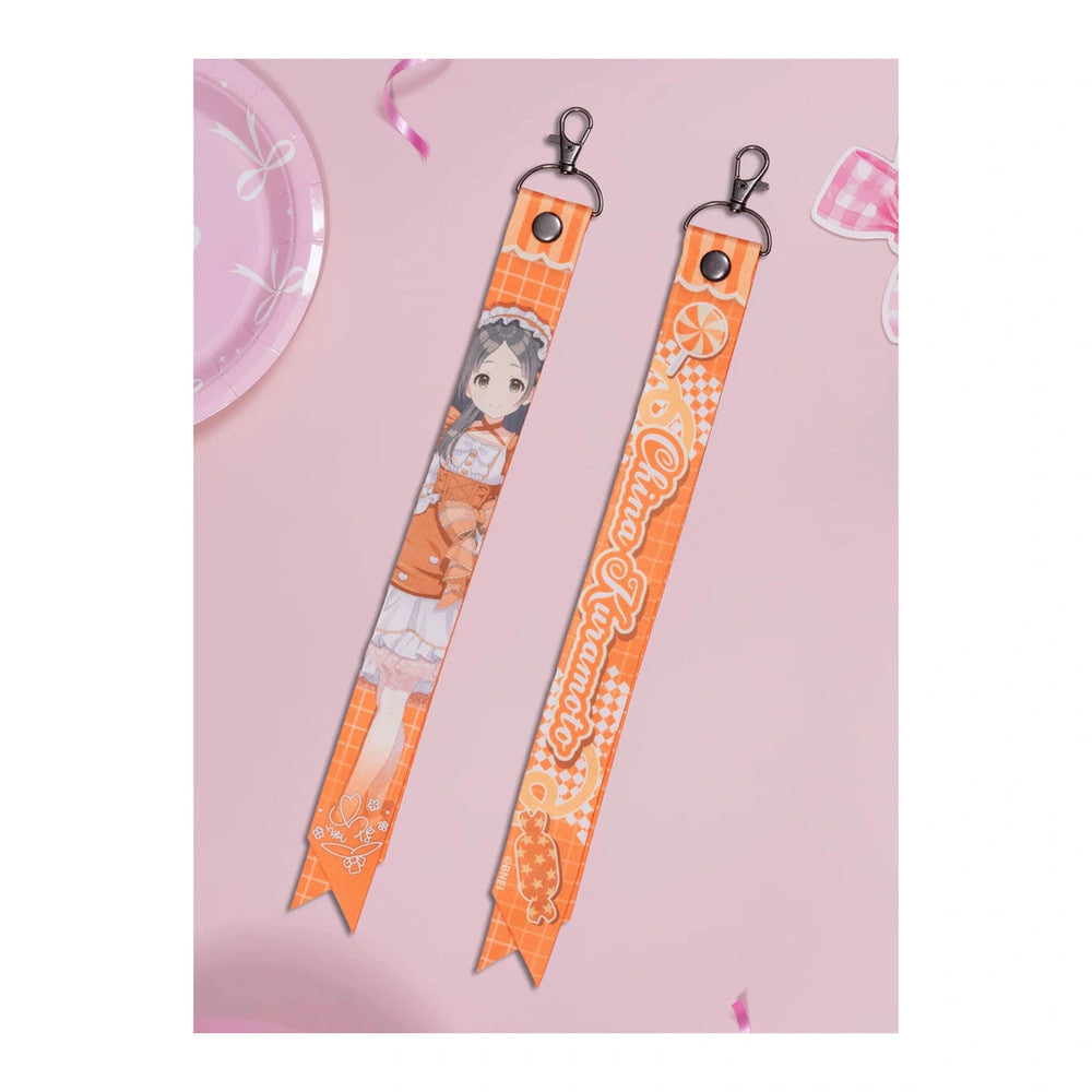 Front and back of the China Kuramoto ribbon keychain: illustration with signature, and the name China Kuramoto