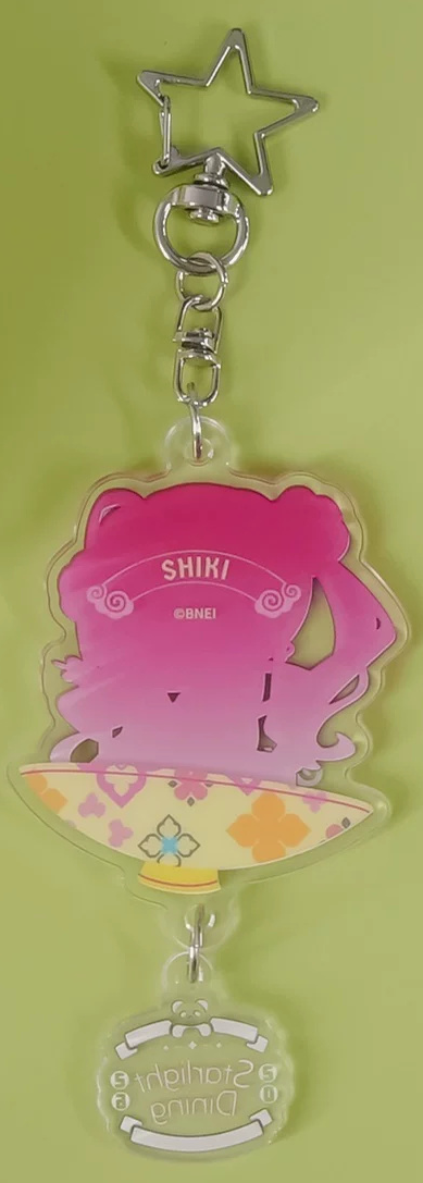 Back of the keychain: silhouette printed with the name SHIKI
