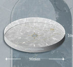 Clear wave-pattern acrylic record weight, 90 mm across and 10 mm thick