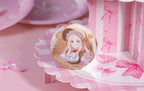 Sena Juo design: long blonde hair under a brown frilled bonnet with an orange bow