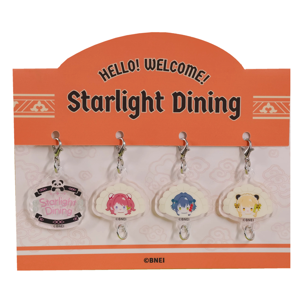 Set packed on an orange Starlight Dining header card: logo charm and Saki, Temari and Kotone dumpling-shaped charms