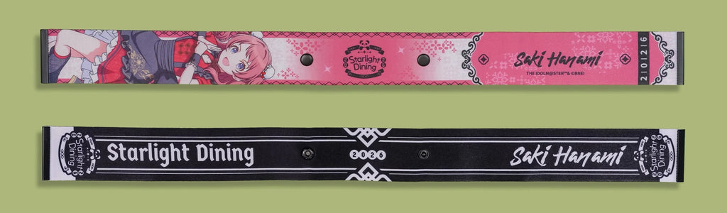 Front and back of the same strap; the black back reads Starlight Dining, 2026 and Saki Hanami