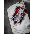 Front of the Amoris acrylic keychain: ornate frame with red flowers, gold-tone clasp and a lavender teardrop charm