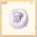 Sleeping Xavier figure in pajamas and a nightcap, seated in a matching patterned miniature beanbag.