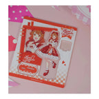 Acrylic stand parts on the printed sheet: Ume Hanami figure in a red lolita dress, base and signature plate