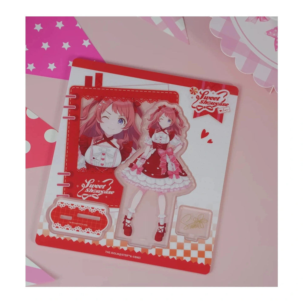 Acrylic stand parts on the printed sheet: Saki Hanami figure in a red lolita dress, base and signature plate