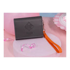 Black flap card case pressed with the Hatsuboshi Gakuen crest, with an orange wrist strap (props not included)
