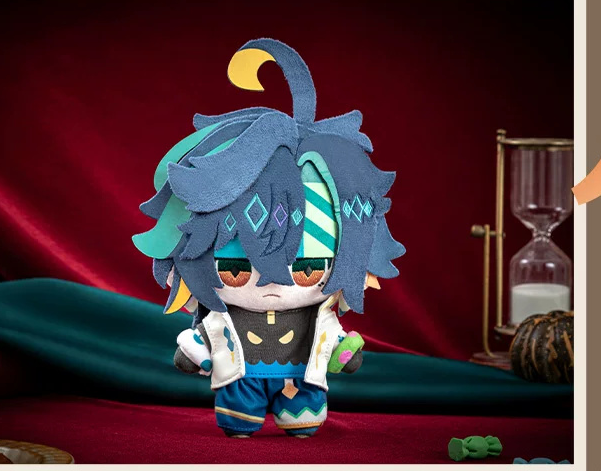 Kinich plush on a red velvet backdrop beside an hourglass (props not included)