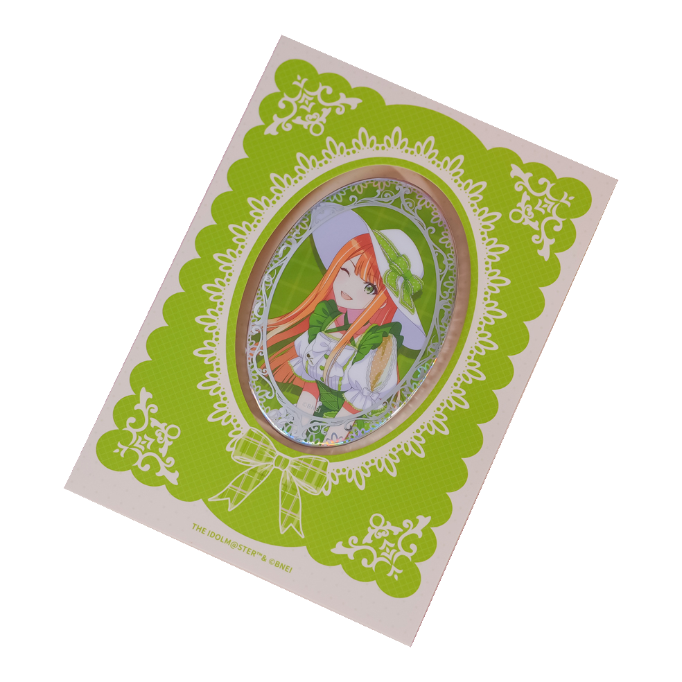 Sumika Shiun oval holographic badge on its lime green lace-patterned backing card.