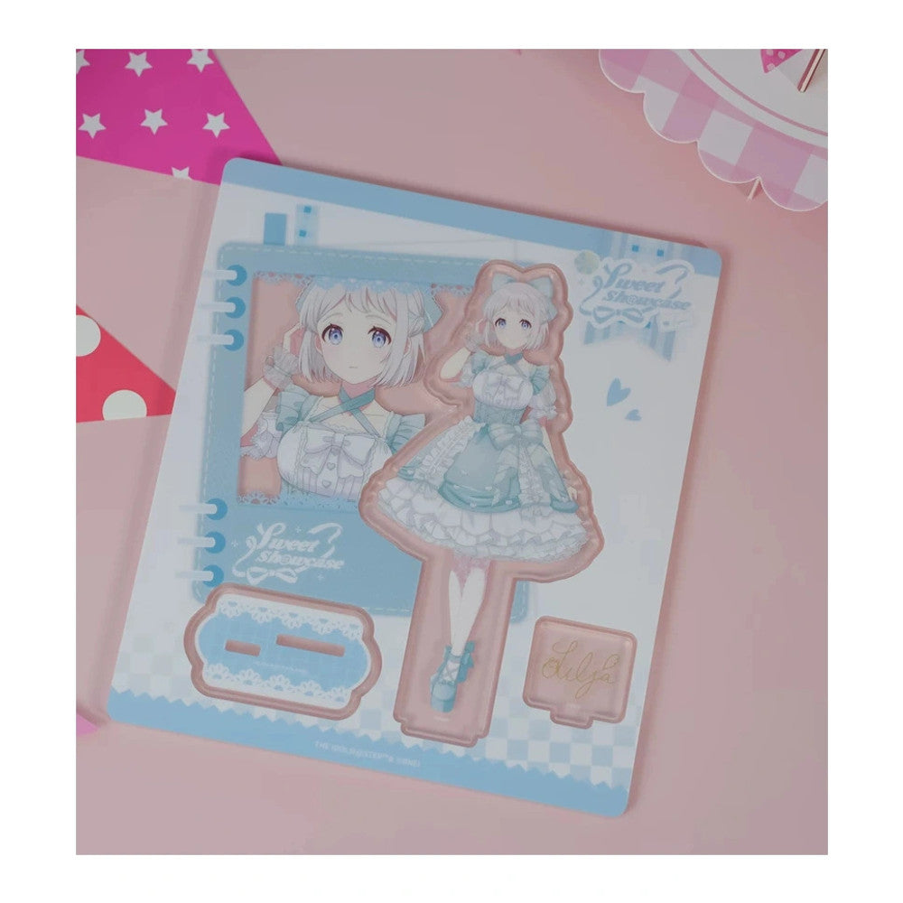 Acrylic stand parts on the printed sheet: Lilja Katsuragi figure in a pale blue lolita dress, base and signature plate