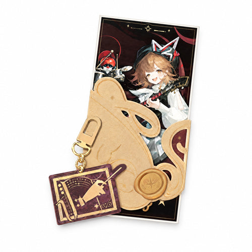 Regulus ticket with a gold decorative cover and wax-seal motif, plus a burgundy acrylic keychain