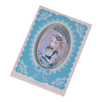 Hiro Shinosawa oval holographic badge on its turquoise lace-patterned backing card.