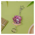 Acrylic keychain: chibi Shiki Ichinose on a bowl-shaped base, holding a candied-fruit skewer; star clasp and logo charm
