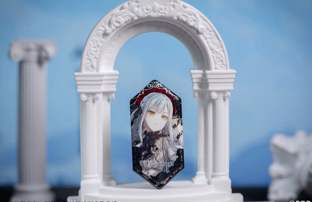 Oblivionis (Sakiko Togawa) badge standing in a white arch display prop