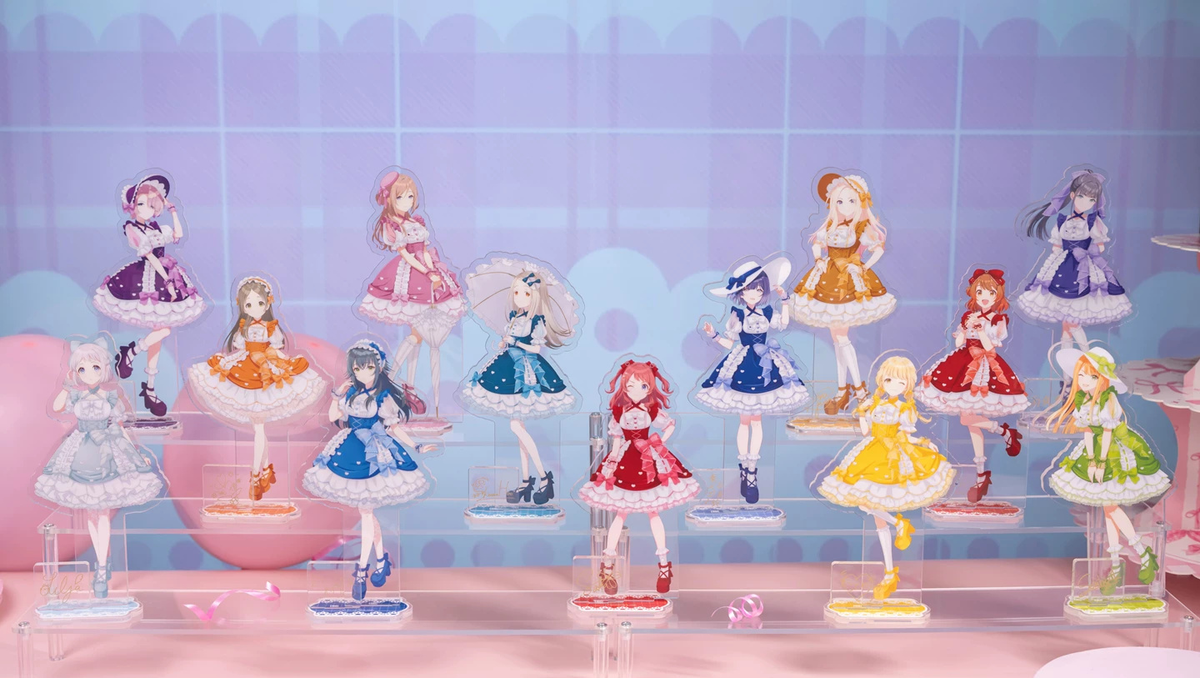 Lineup of 13 assembled Sweet Showcase acrylic stands on a display riser; only the Ume Hanami stand is included