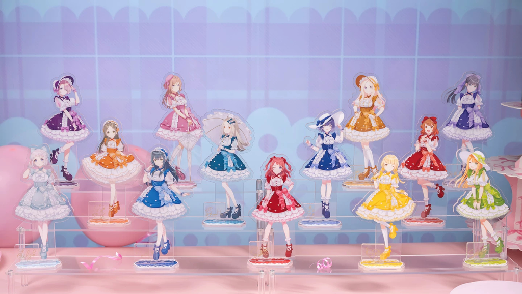 Lineup of 13 assembled Sweet Showcase acrylic stands on a display riser; only the Rinami Himesaki stand is included