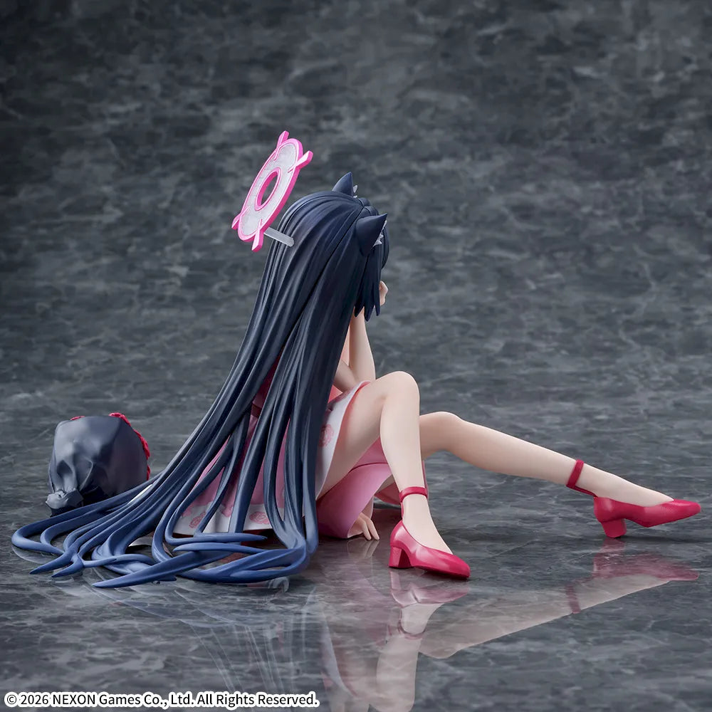 Side-back view showing her long hair spread on the floor and her red heels