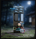 Official scene photograph: Nezuko Kamado A Moment of Rest block figure seated in front of a building.
