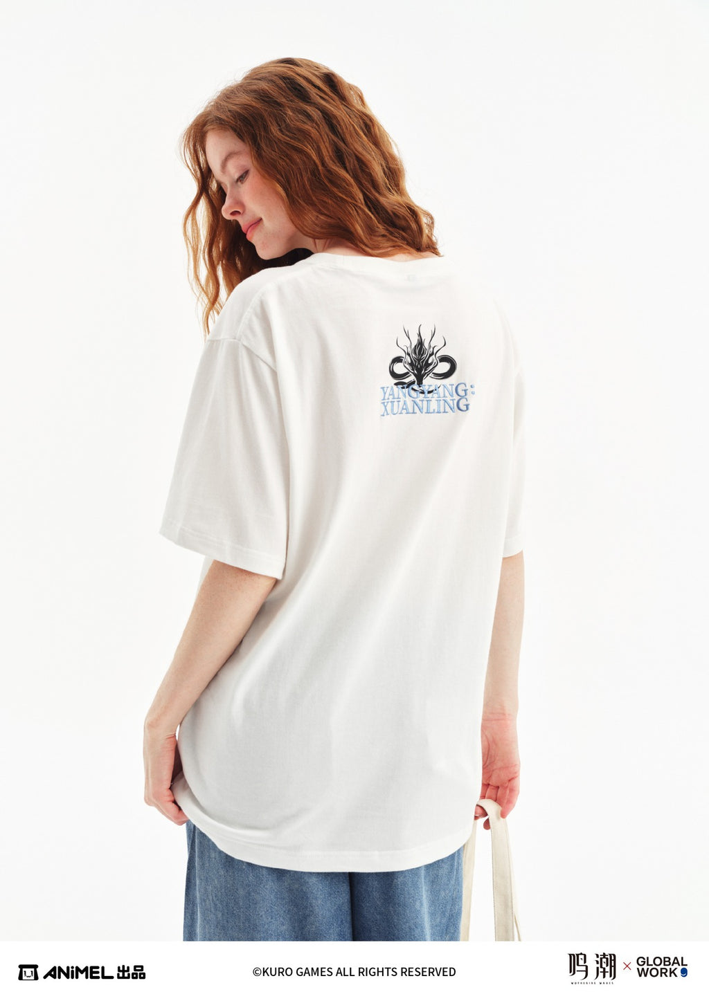 Back of the T-shirt on a model: black dragon emblem above light-blue 'YANGYANG: XUANLING' lettering