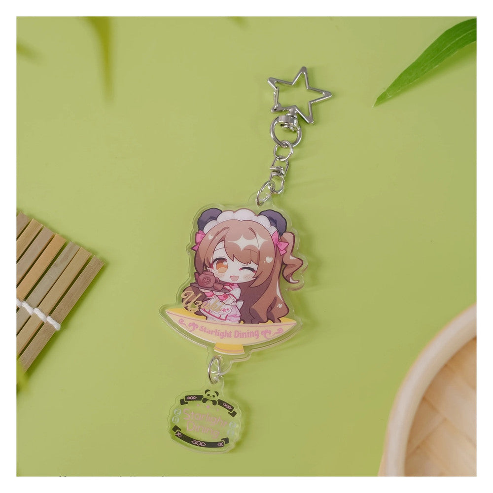 Acrylic keychain: chibi Uzuki Shimamura on a bowl-shaped base, winking in a panda-ear headpiece; star clasp and logo charm