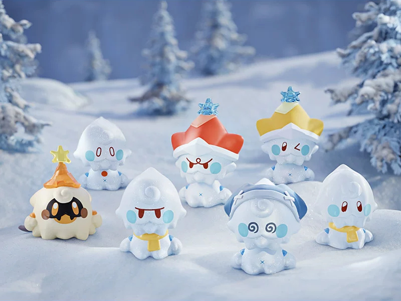 Seven Jack Frost figures in the snow with different faces, hats and scarves