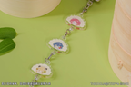 Saki, Temari and Kotone charms linked into one strand with their clasps